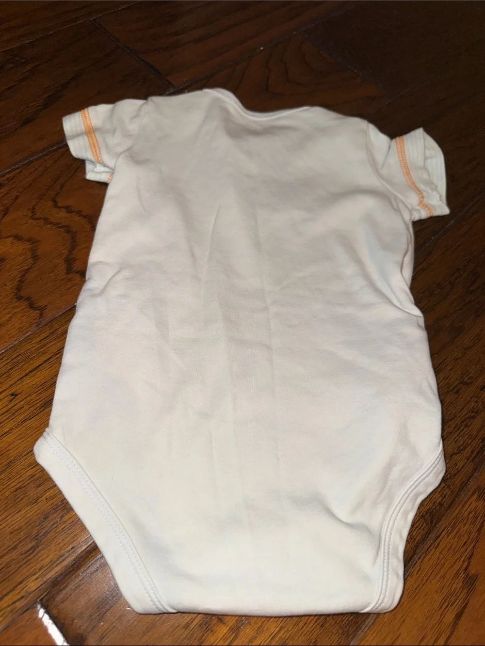 Baby Short-Sleeve One-Piece Bodysuit and a blue zipper sweater